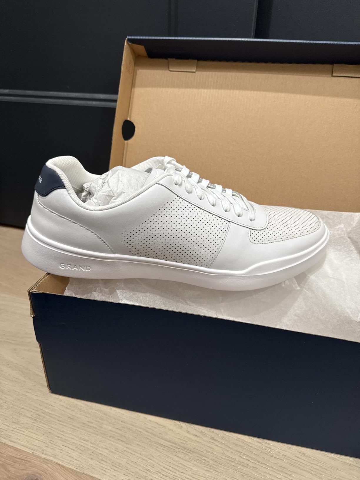 Cole Haan sneaker detailed view of perforated leather upper construction and lacing system