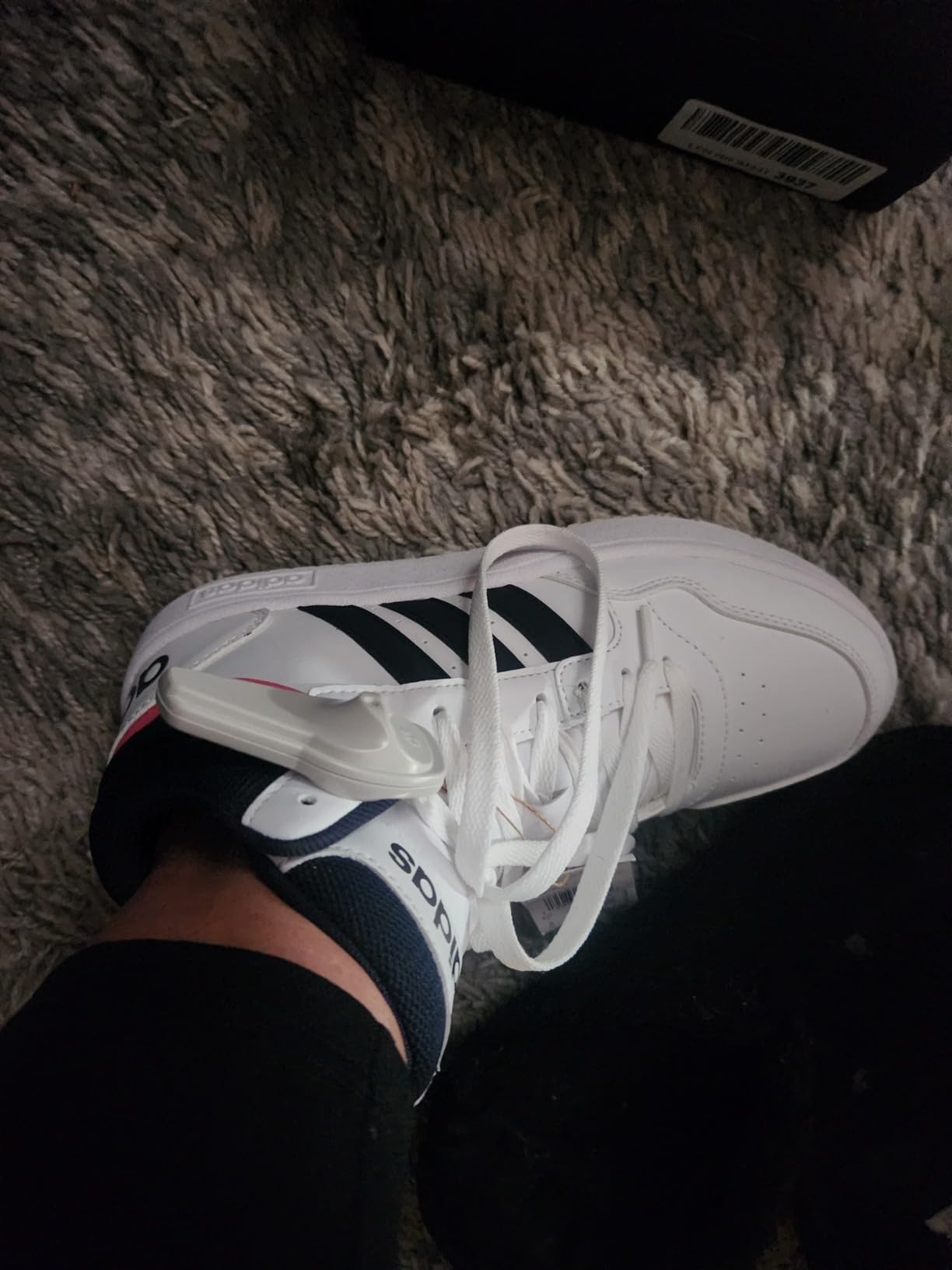 Side view of Adidas Hoops 3.0 Mid showing mid-cut ankle support design