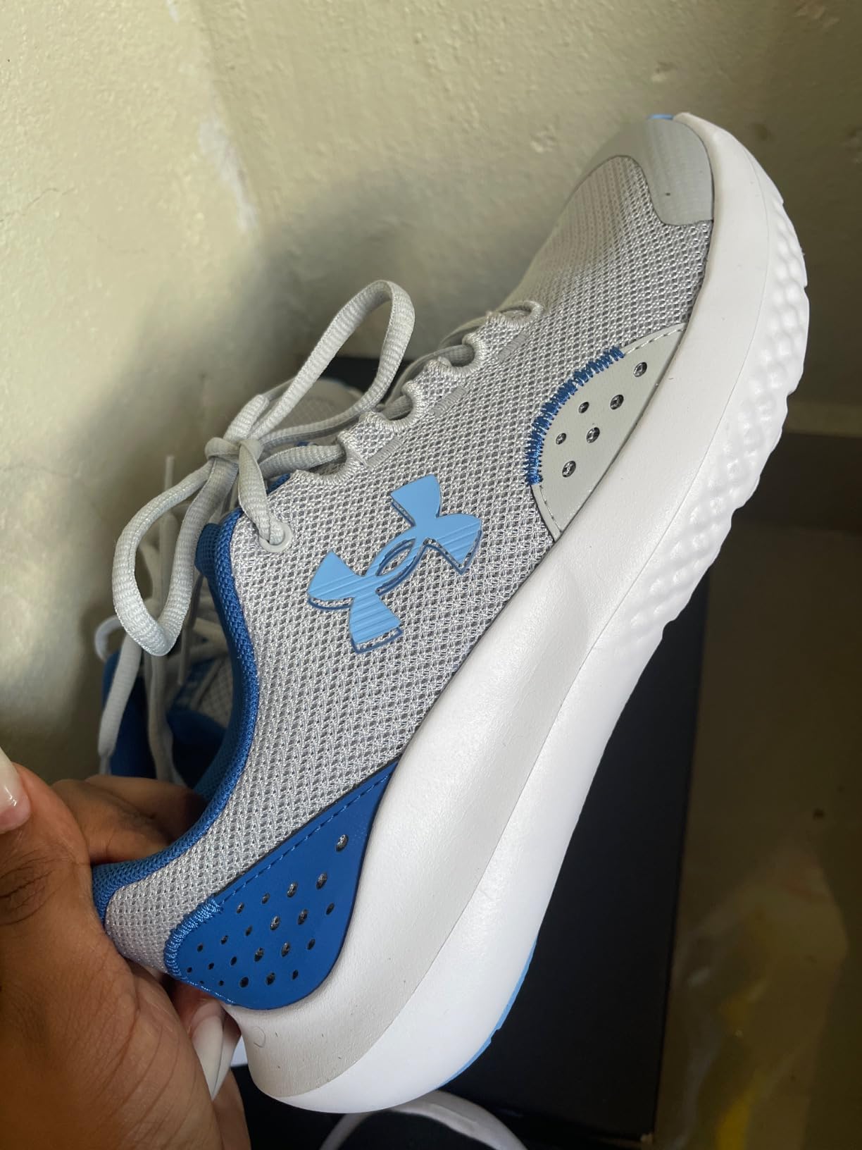 Under Armour Boys Surge 4 lifestyle shot showing real world usage by active kids