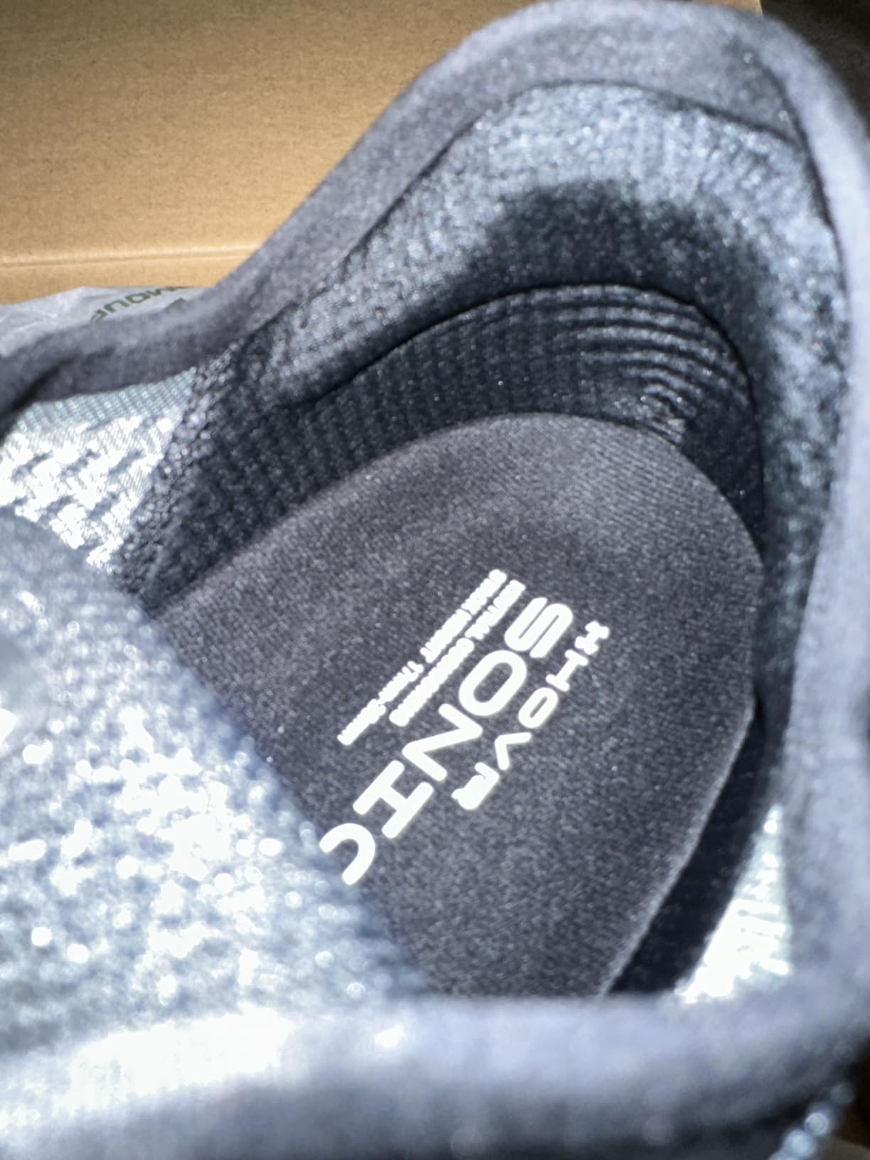 Under Armour Men's HOVR Sonic 6 running shoe showing engineered mesh upper and external heel counter design
