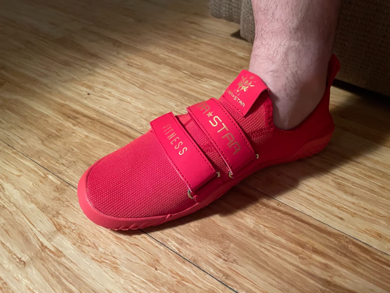 Close-up view of deadlift shoe upper construction showing textile knit material and velcro strap system