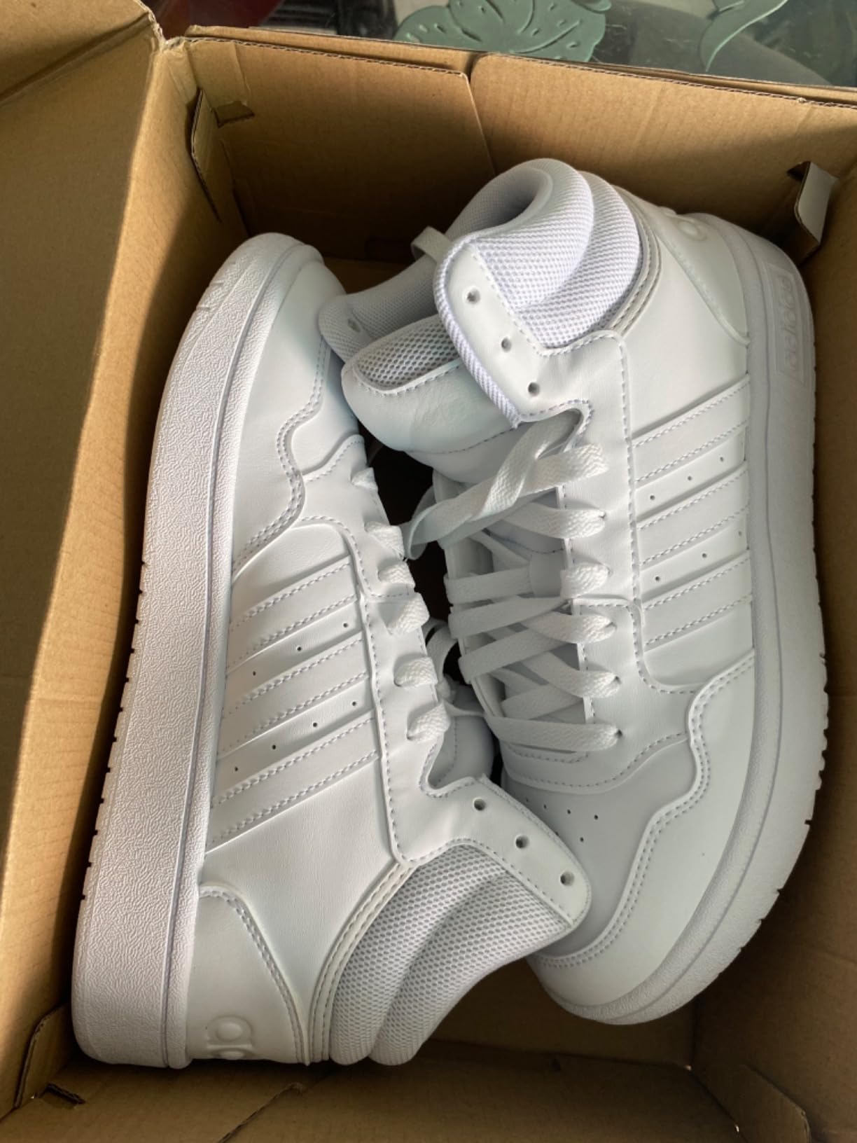 Adidas Hoops 3.0 Mid basketball shoes in action on court showing grip and performance