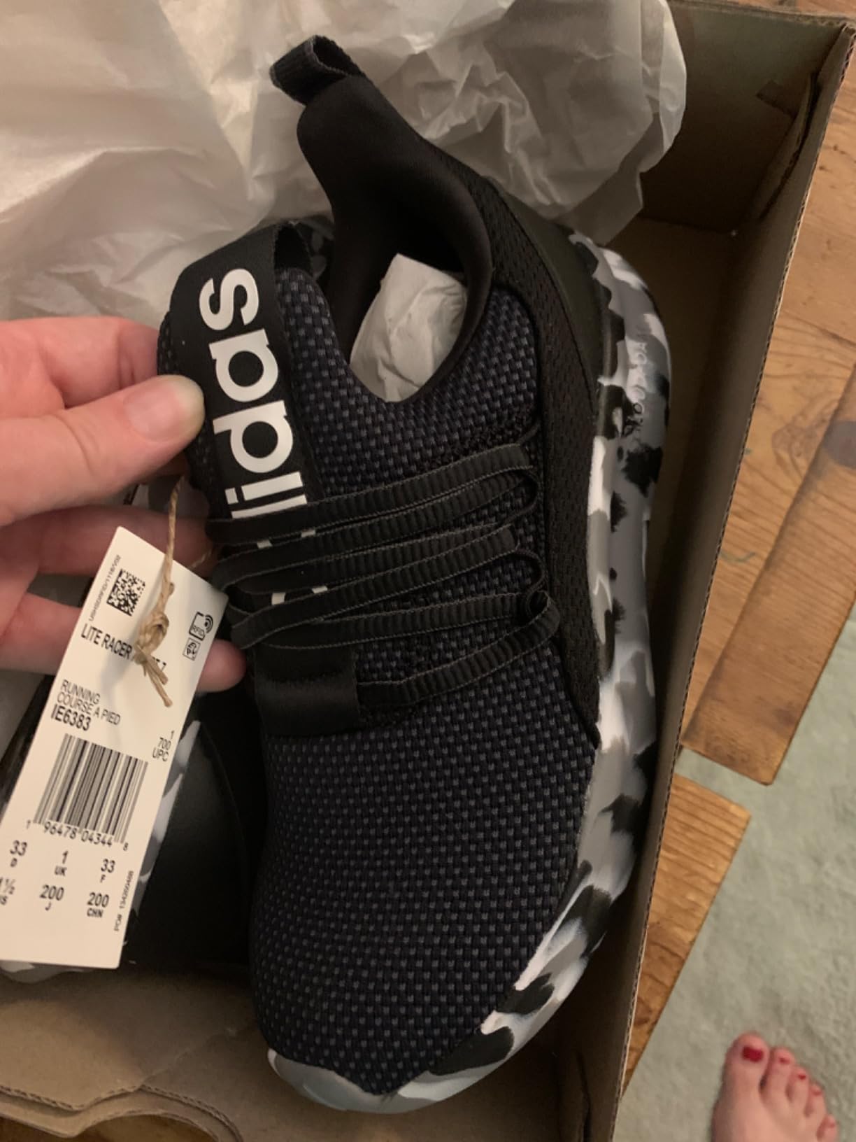 Adidas Lite Racer sizing and fit demonstration showing proper foot accommodation