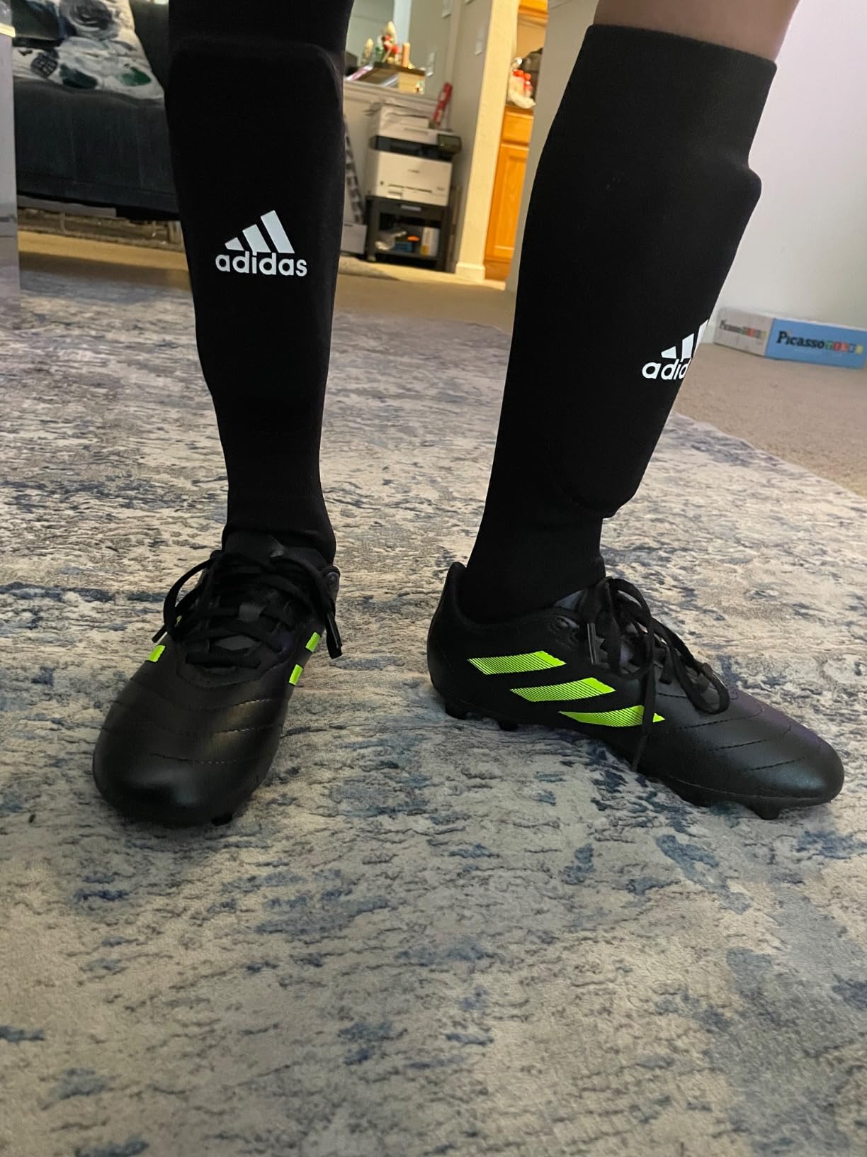 Adidas Goletto VII cleats showing wear patterns after several weeks of youth soccer use