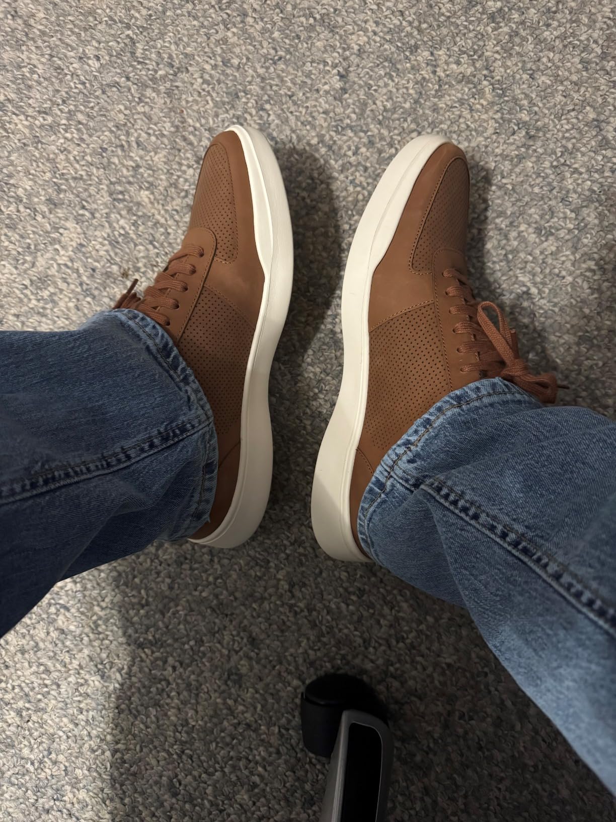 Cole Haan sneakers being worn in real-world scenarios showing versatility from office to casual wear