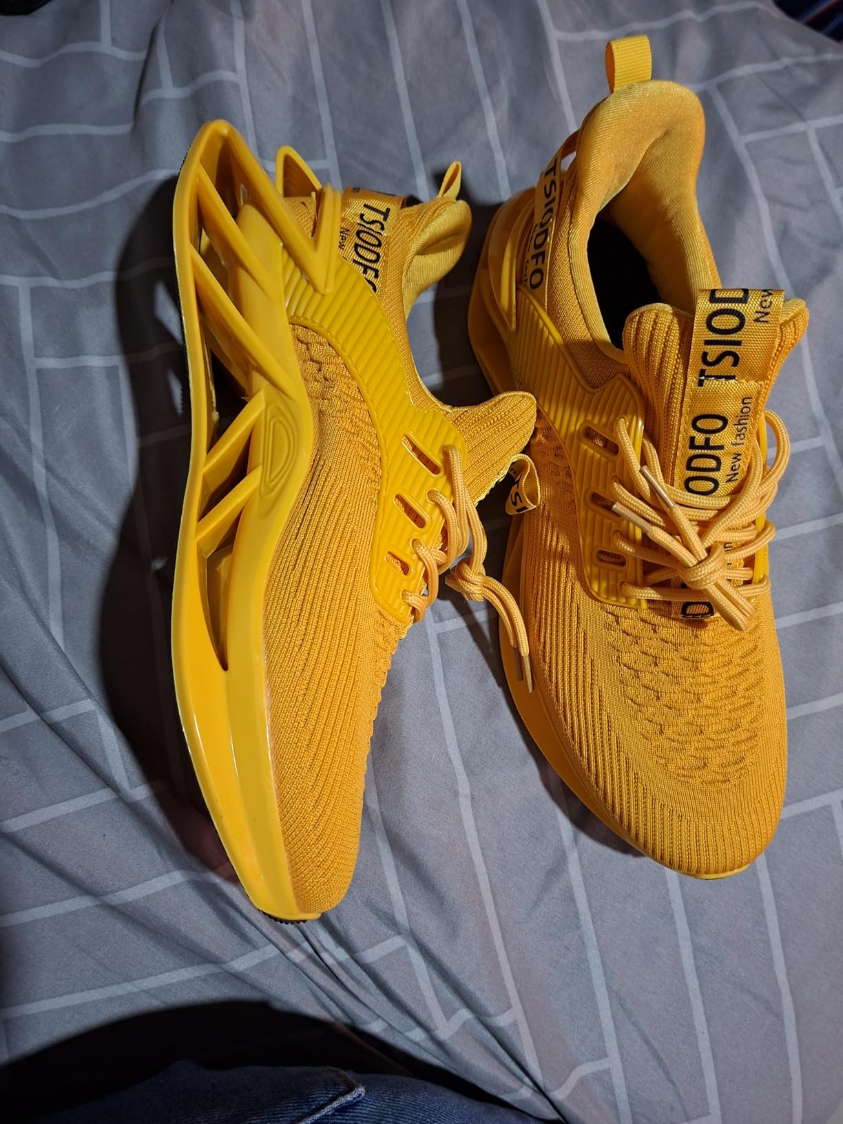 Close-up view of SKDOIUL sneaker mesh upper construction showing breathable fabric and lace-up design