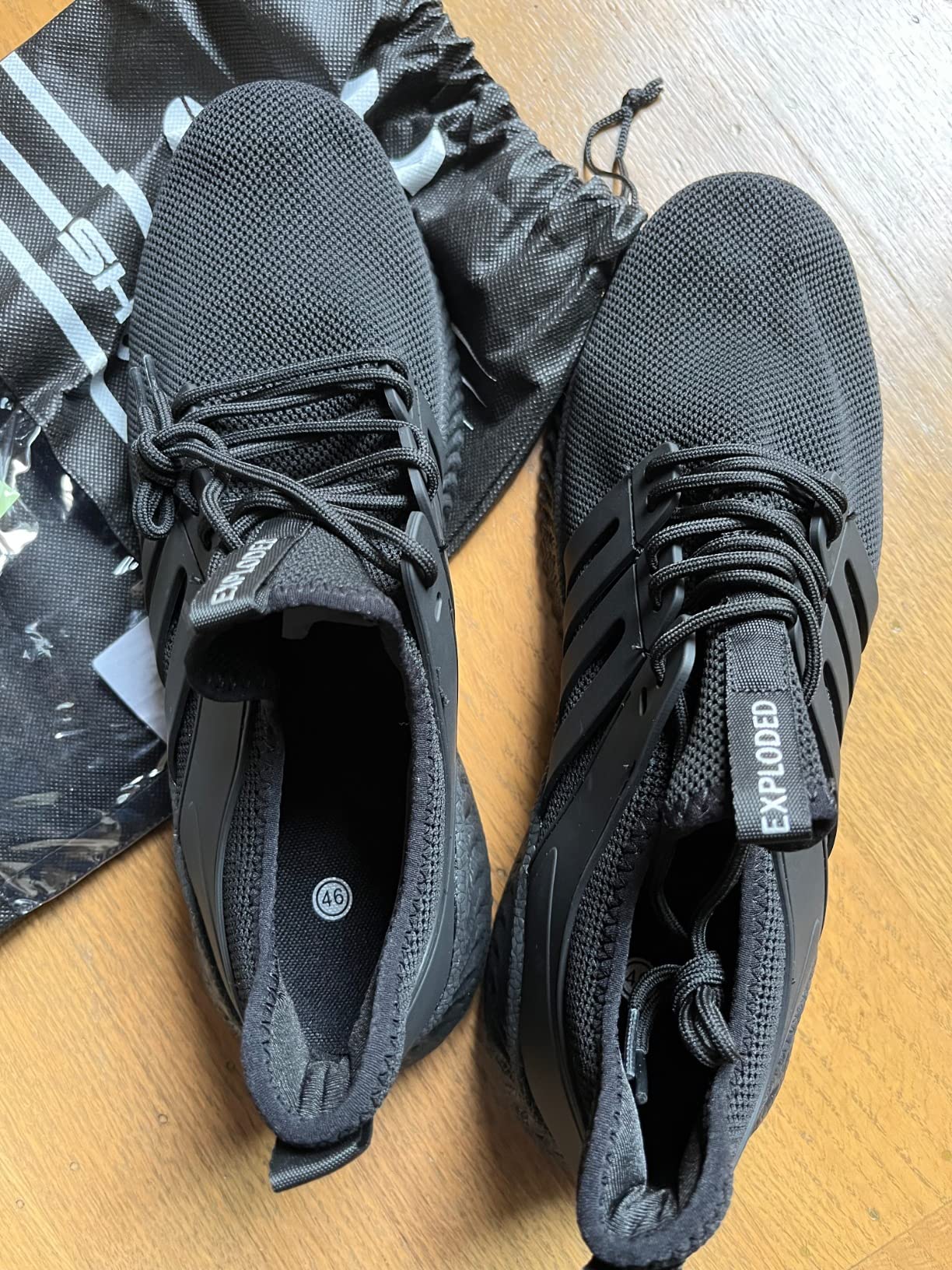 AKK sneakers detailed view showing knitted mesh upper and slip-on construction