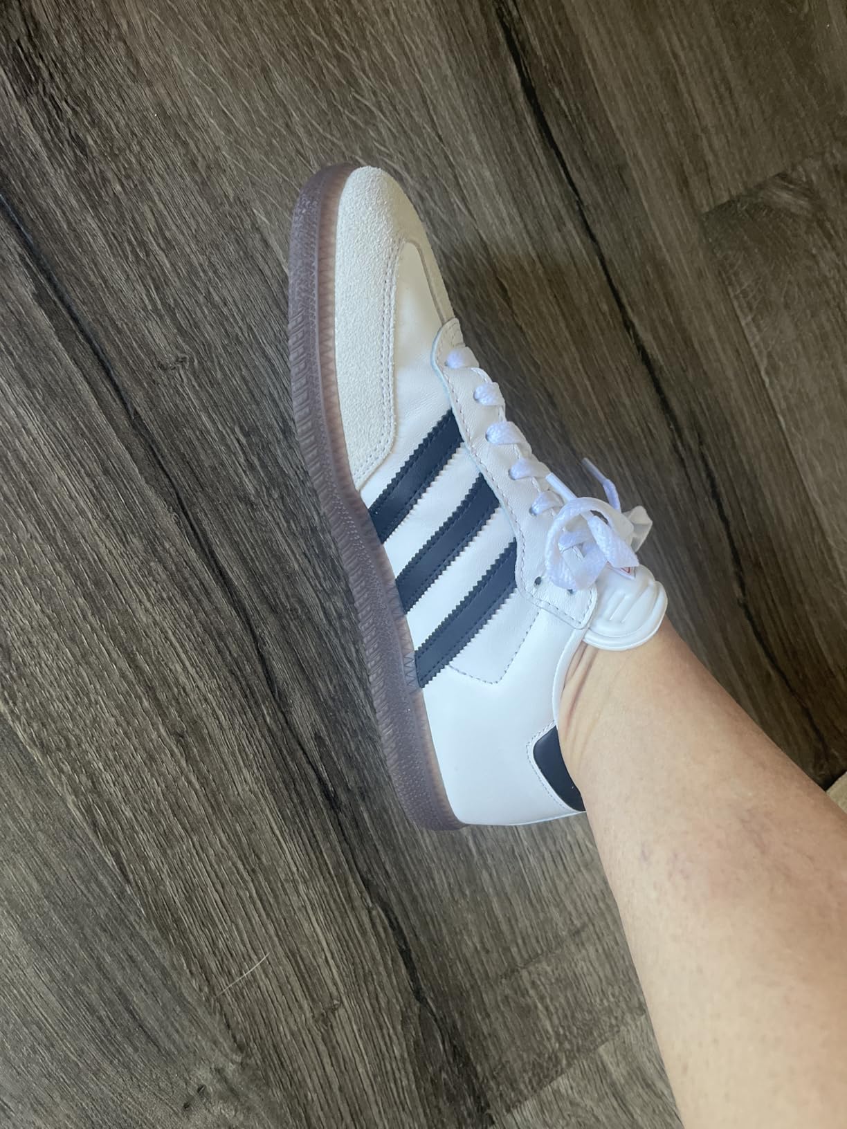 Adidas kids Samba side view showing classic profile and indoor soccer sole pattern