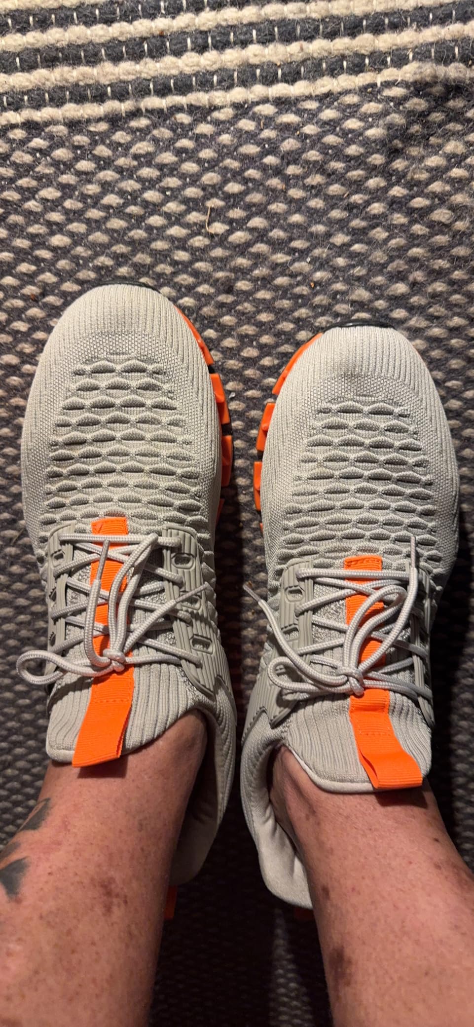 Side profile view of slip-on sneaker highlighting the distinctive blade sole design and cushioning system