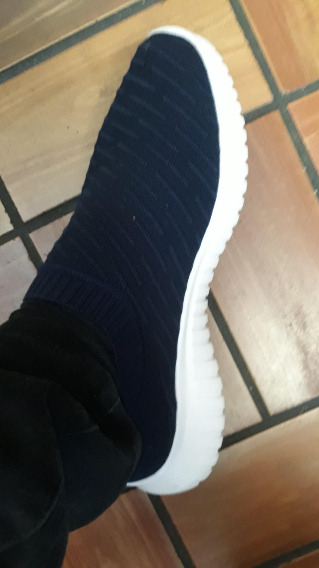 Close-up of konhill walking shoes showing knit upper texture and slip-on design details