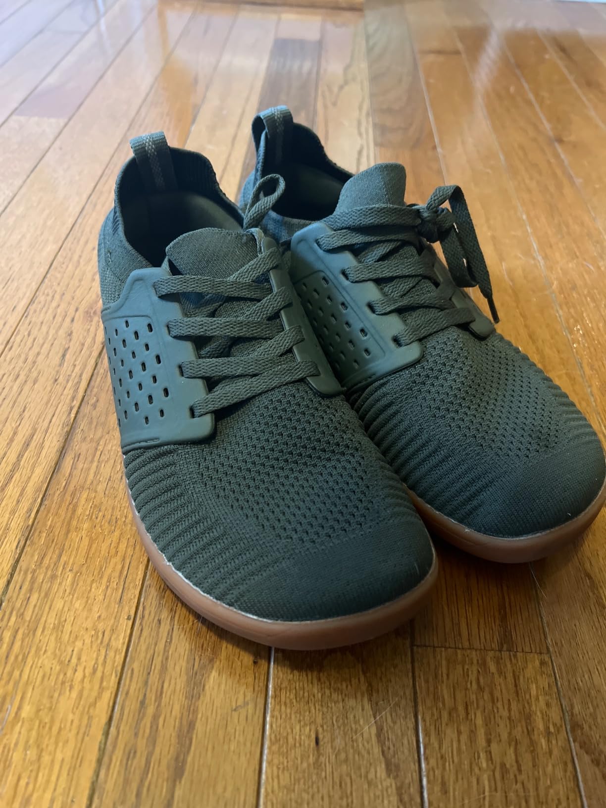 Bottom view showing sticky-grip rubber outsole pattern and zero drop construction of WHITIN barefoot sneakers