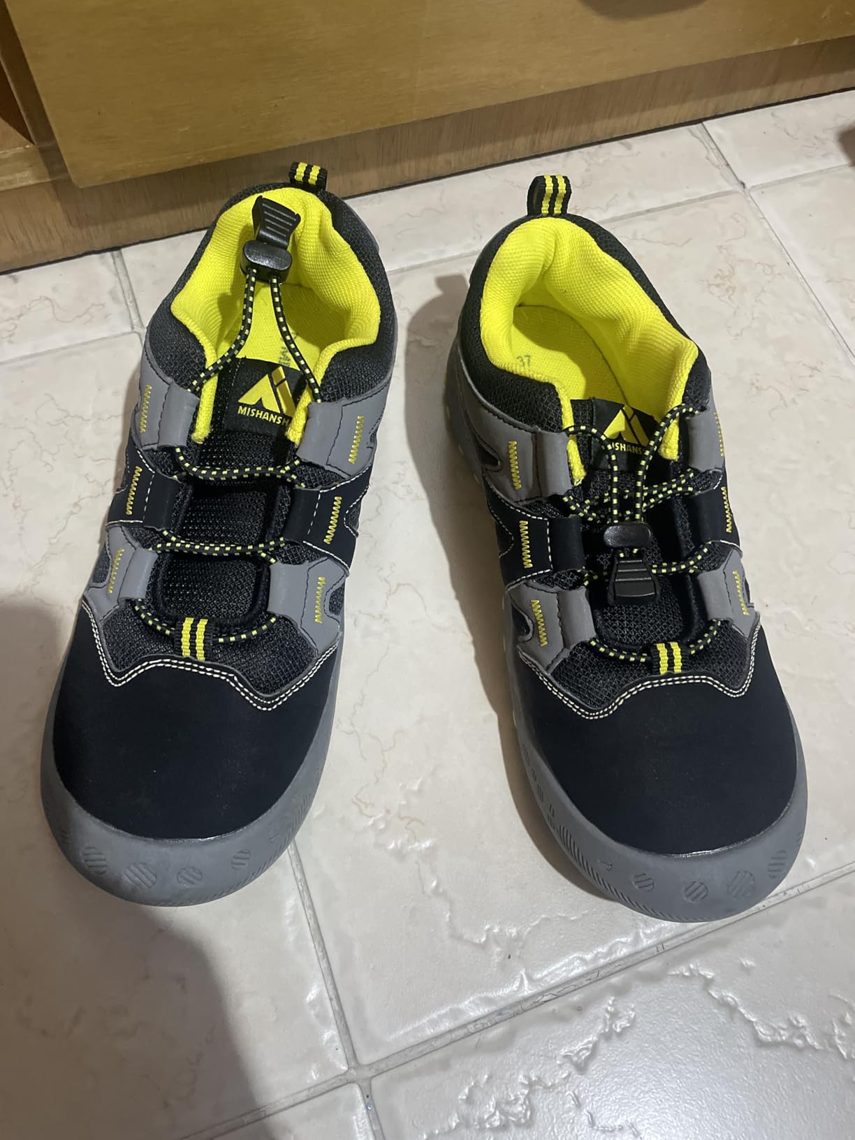 Close-up view of Mishansha hiking boots showing oxford fabric upper construction and mesh ventilation panels