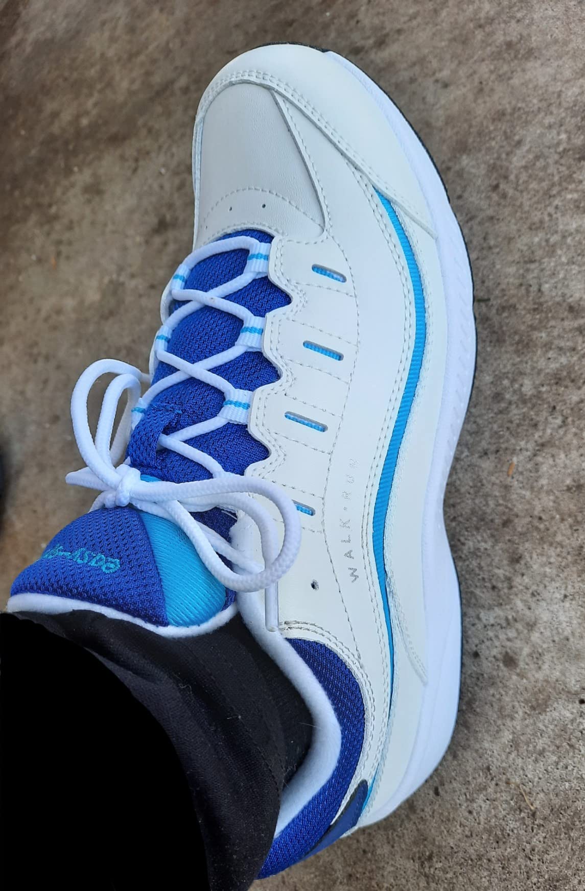 Easy Spirit Romy sneaker detail view showing leather upper construction and lace-up closure system