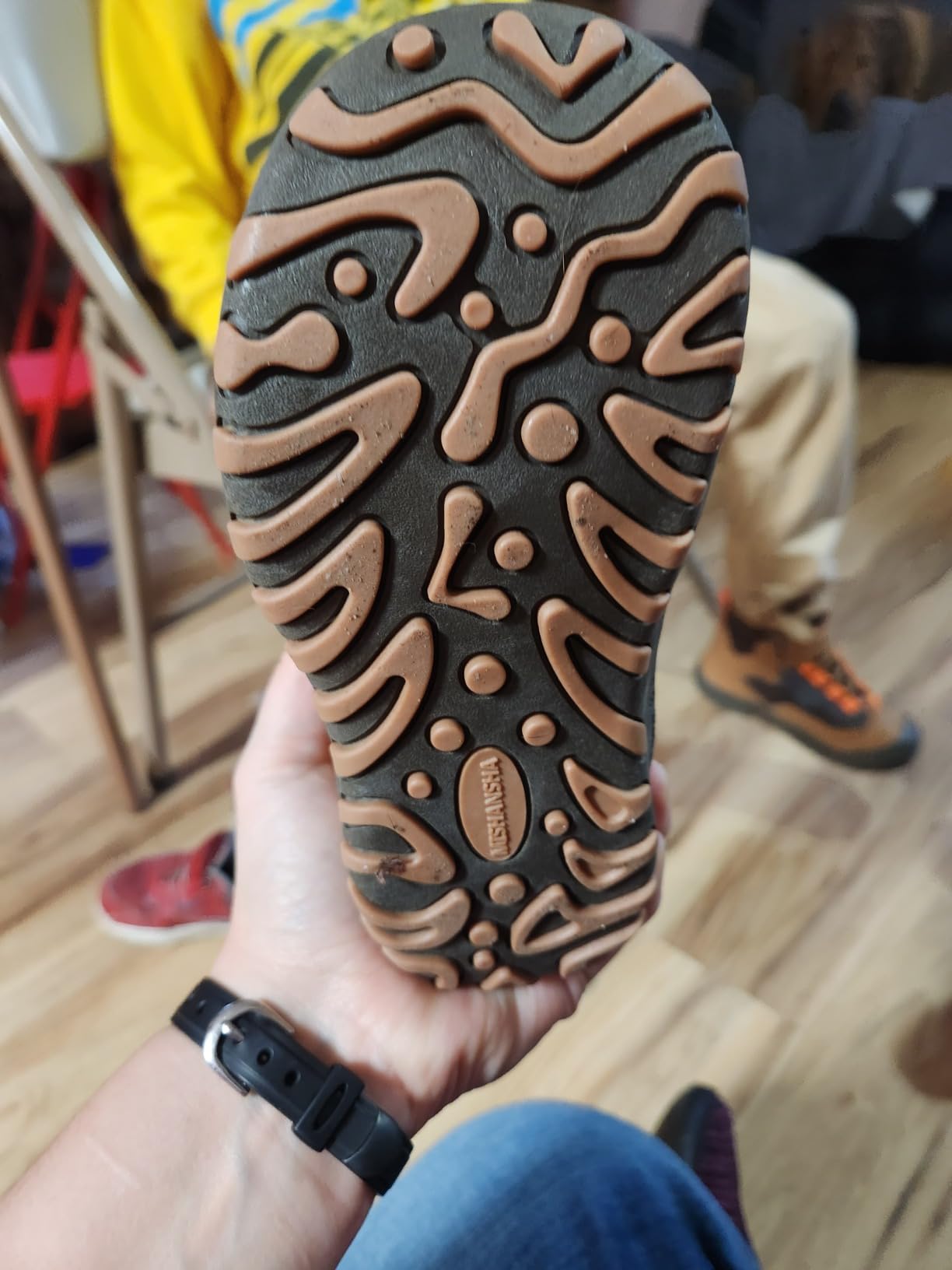 Mishansha hiking boots tested in muddy outdoor conditions showing traction pattern and weather resistance