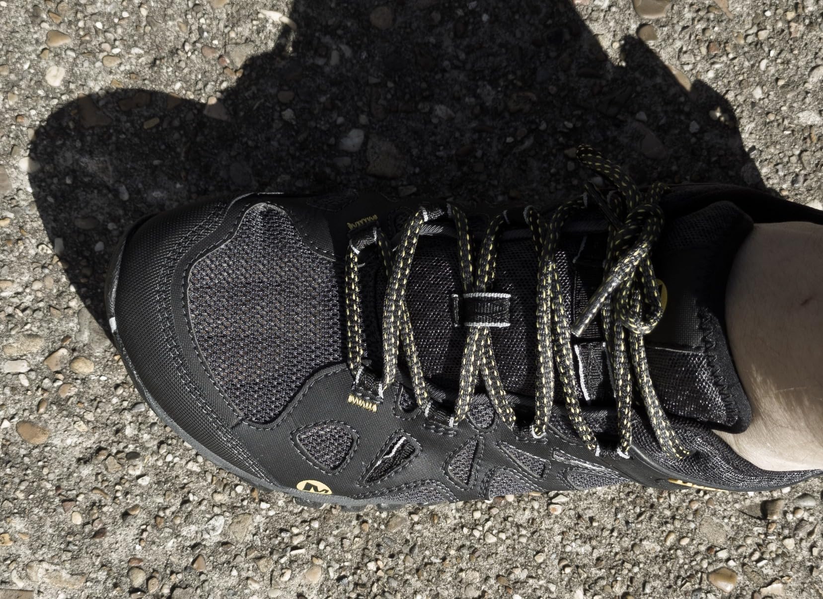 Detailed view of toe box and mesh construction showing durability after extensive use