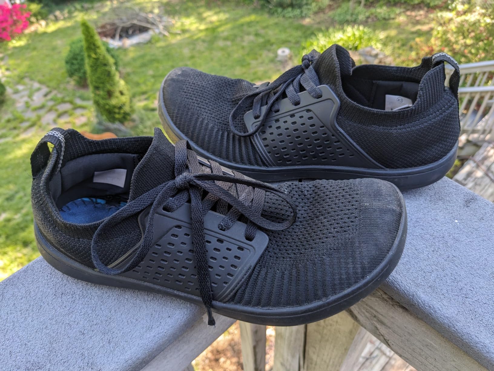 Lifestyle shot of WHITIN sneakers during outdoor walking showing real-world usage and durability