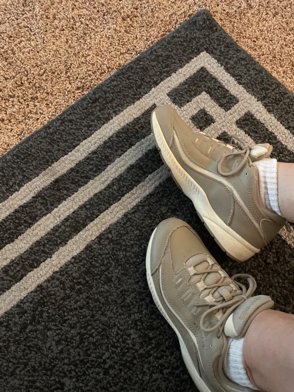 Easy Spirit Romy sneakers being worn for daily activities showing practical leather upper design