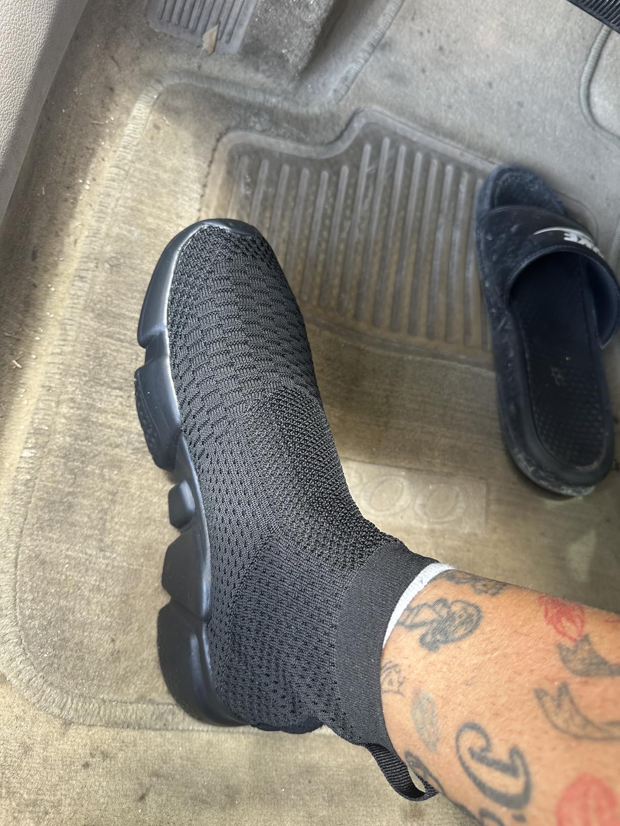 Close-up detail of Santiro walking shoes showing breathable knit upper material and high-top design